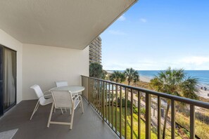 Outdoor dining - Third-floor beachfront condo with a spacious private balcony and $300 of Free Fun Included Daily! (Panama City Beach)