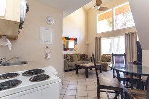 Cozy living space with a kitchenette, dining area, and comfortable seating.