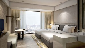 A modern hotel room with a large bed, a desk, a chair, and a view of the city. - Gateway Ahmedabad Sindhu Bhavan (Ahmedabad)