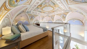 A bedroom with a vaulted ceiling, a bed, a bedside table, and a window. - La rosa, Luxury villa private pool Equipped With Conforts, wide garden,parking (Sorrento)