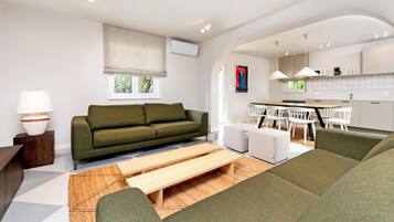 Deluxe Apartment, 4 Bedrooms, Terrace, Pool View | Living room | Flat-screen TV