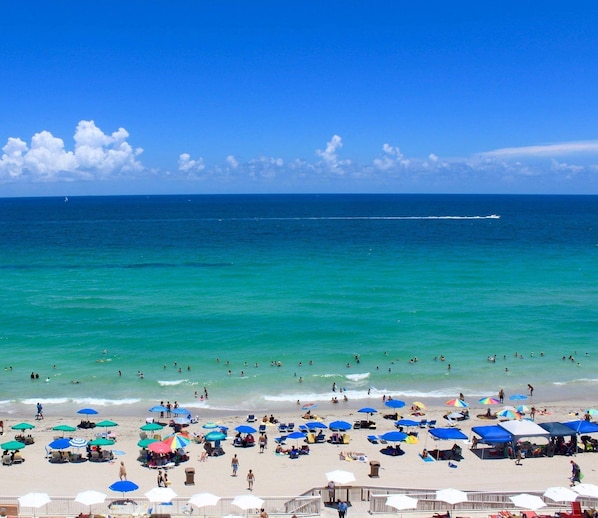 On the beach, sun-loungers