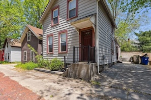 A two-story house with a front porch and a garage.