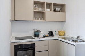 Fridge, oven, coffee/tea maker, cookware/dishes/utensils