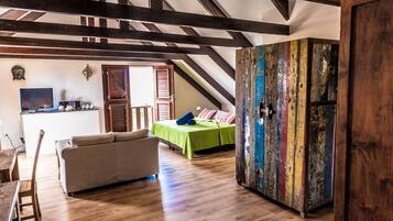 Romantic Room, 1 Bedroom | Living area | 35-inch flat-screen TV with cable channels, TV, iPod dock