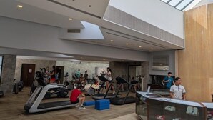 A spacious indoor gym with treadmills, stationary bikes, and a yoga area. - Princess Mundo Imperial (Acapulco)