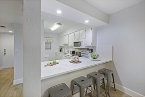 Condo, 1 King Bed (Spacious condo with lanai, pool and s) | Private kitchen