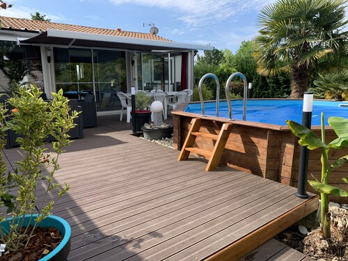 House with large veranda terrace and above-ground pool