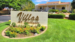 A sign for "Villas at Southgate" with a well-maintained garden in front. - Villas at Southgate (St. George)