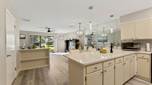 A spacious kitchen with a large island, modern appliances, and a view of the outdoors. - Beautiful modern townhouse with beach access and private parking (Panama City)