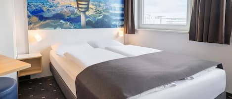 Ropa de cama hipoalergénica, escritorio y sistema de insonorización