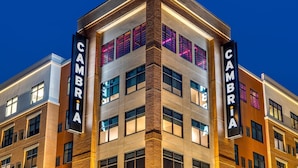 A modern building with the name "CAMBRIA" displayed prominently on its facade. - Cambria Hotel Rock Hill - University Center (Rock Hill)