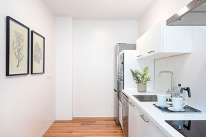 Appartement (3 Bedrooms) | Cuisine privée | Réfrigérateur, four, plaque de cuisson, lave-vaisselle
