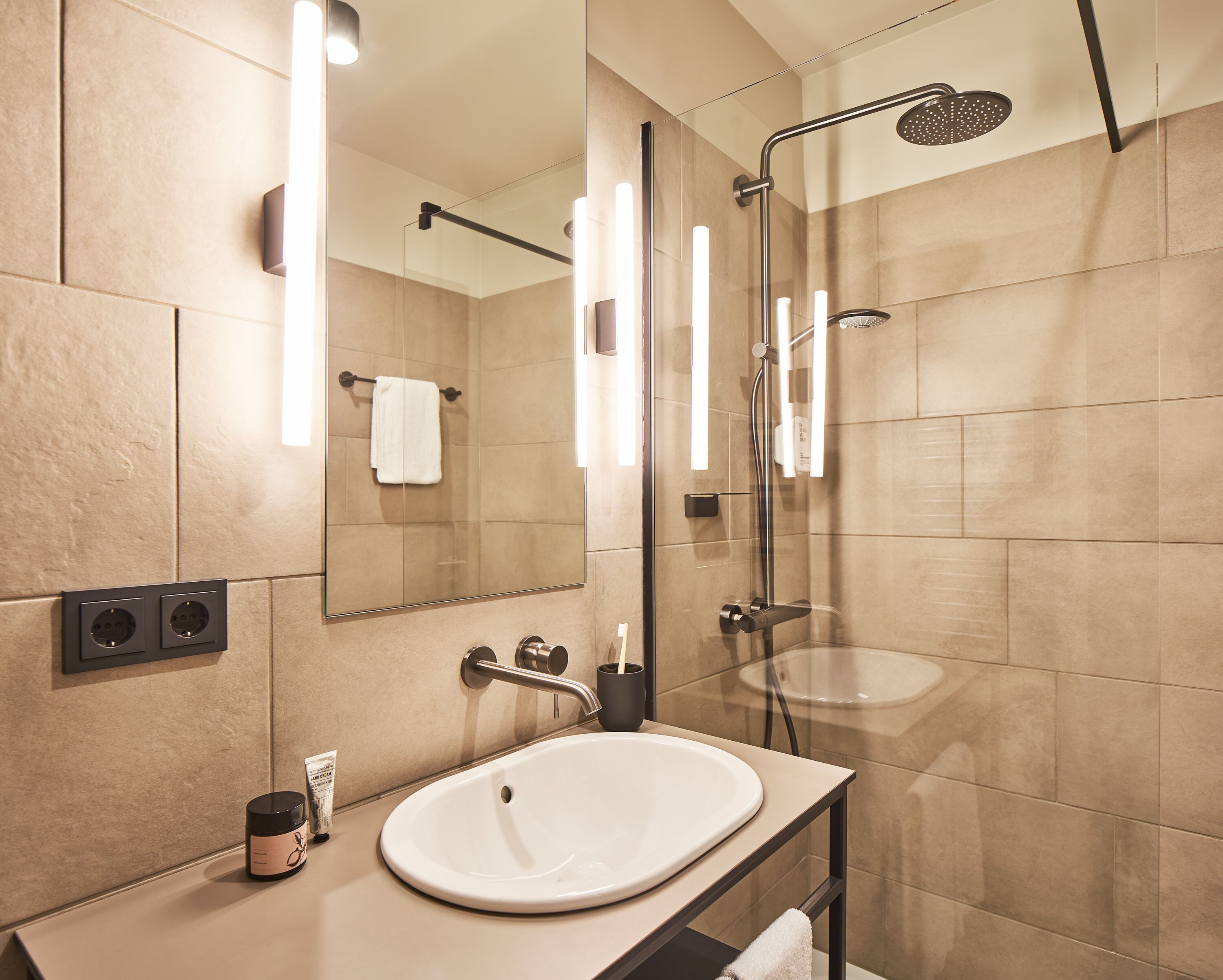 Shower, rainfall showerhead, hair dryer, towels
