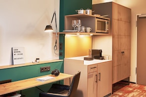 Full-sized fridge, microwave, coffee/tea maker, cookware/dishes/utensils
