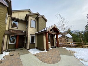 Stunning two-story home with a covered porch and mountain views.