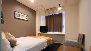 A hotel room with two beds, a TV, a small table, and a window with curtains. - Hotel Areaone Okayama (Okayama)