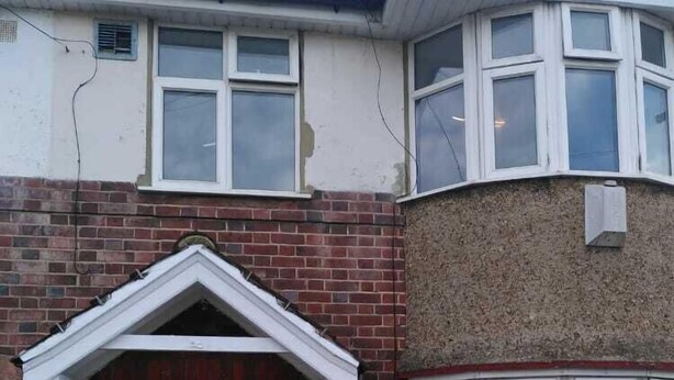 A two-story house with a white front door, a small porch, and a brick exterior. - Remarkable 3-bed House in Hounslow (Hounslow)