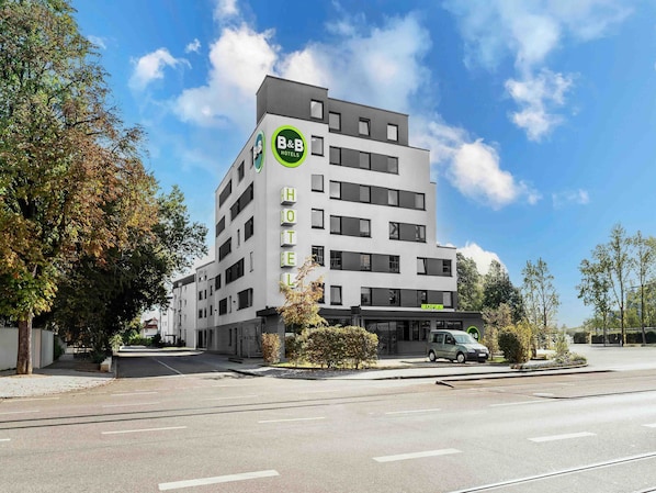 A B&B hotel with a modern design, featuring a prominent B&B logo on the facade.