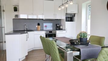 Haus Nina - Sonnenweg 20 | Private kitchen | Fridge, microwave, oven, stovetop