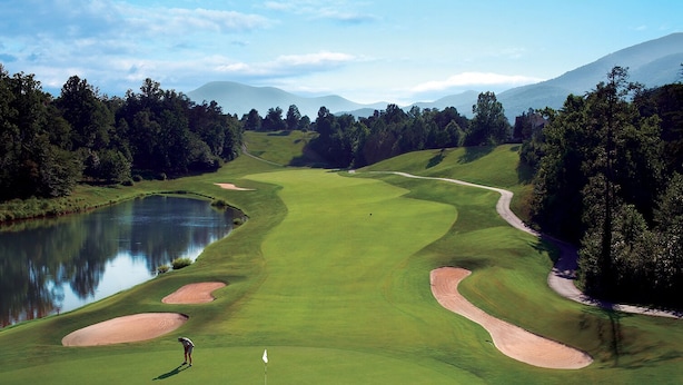A golf course with a pond, sand bunkers, and a flagstick. - One of the Best Views in Wintergreen! (Wintergreen Resort)