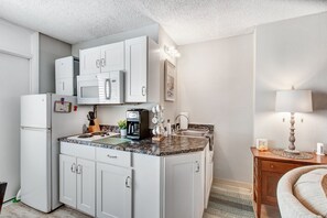 Fridge, microwave, stovetop, coffee/tea maker