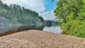 On the beach, sun-loungers