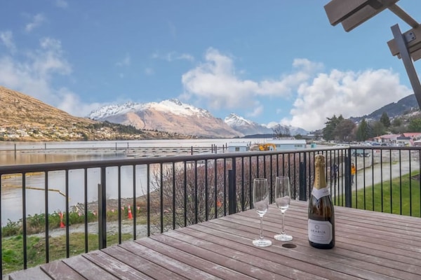 Deck with lake and mountain views