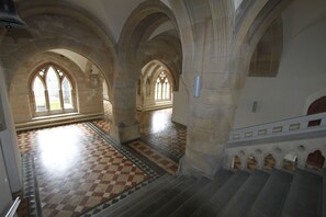 A corridor with arched ceilings and a checkered floor pattern. - Inver at Highland Club Scotland (Loch Ness, Scotland)