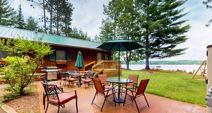 Lakefront cottage w/ a dock, shared furnished patio, firepit, & a paddleboat