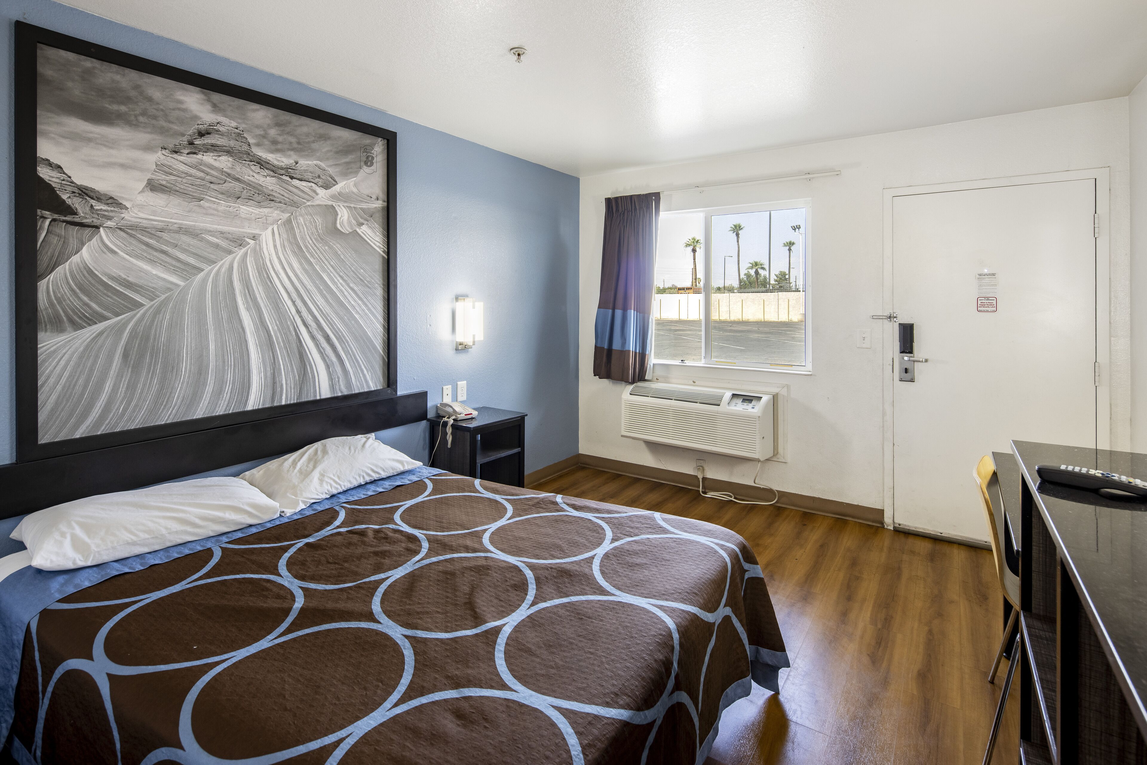 Desk, blackout drapes, bed sheets