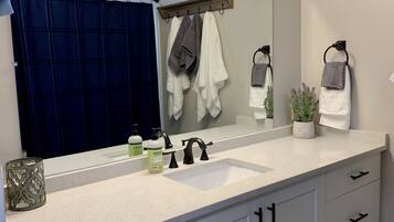 Combined shower/bathtub, hair dryer, towels, soap