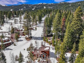 A snow-covered ski resort with cabins and a ski slope. - CW 87 - Tamarack Resort - Private hot tub - Ski in ski out - Views (Donnelly)