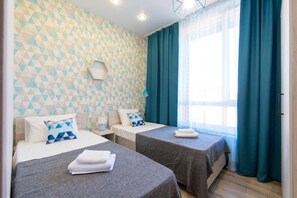 2 bedrooms, desk, blackout curtains, iron/ironing board