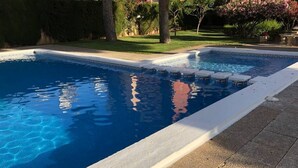 A rectangular swimming pool with a white edge and a tiled deck area. - SAN ANGELO Levante beach apartments (Benidorm)