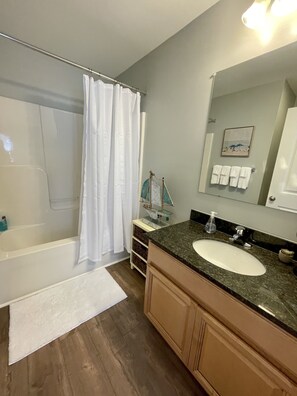 Combined shower/bathtub, hair dryer, towels, soap