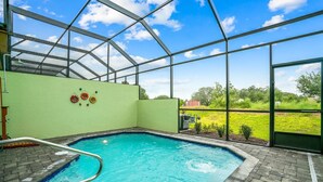 An indoor swimming pool with a clear view of the surrounding landscape through large windows. - 142cd-non Renting 4/1/2022 -festival Resort (Davenport)