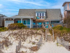 Enjoy stunning ocean views from the spacious balcony of this beachfront home.