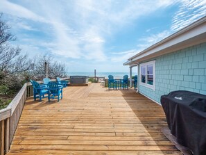 Relax on the deck with ocean views, a hot tub, and Adirondack chairs.