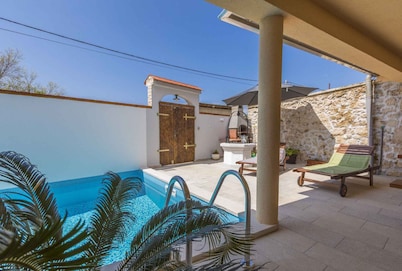 Holiday home in outdoor pool