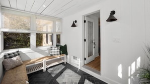 A room with a bench, a door, and a window with blinds. - * Gorgeous Loft Style House w/ Luxury, Charm, & Comfort * (Lutherville-Timonium)