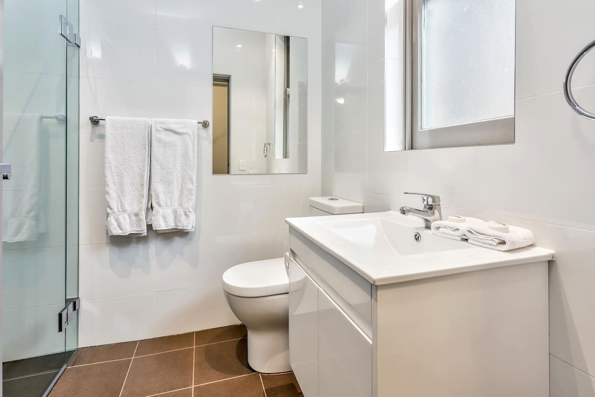 Deluxe Quadruple Room, 2 Queen Beds, Non Smoking, Balcony | Bathroom | Shower, free toiletries, towels, soap