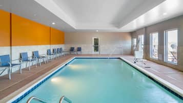 Indoor pool, open 10:00 AM to 10:00 PM, pool loungers