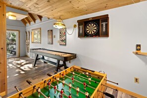 A room with a foosball table, dartboard, and billiards table. - Mooncrest Manor by Destination Big Bear : Expansive Mountain Views! Large Family Spaces! Pet Friendly! Game Room! (Big Bear Lake)