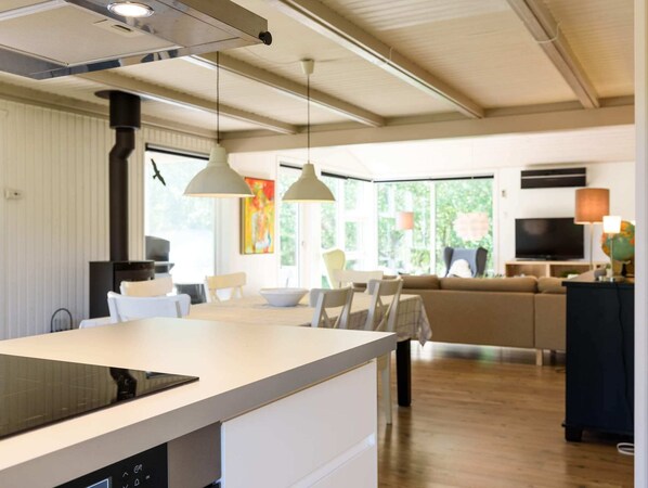 Enjoy cooking and dining in this well-equipped kitchen with a central island and dining area.