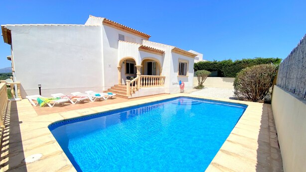 A swimming pool with a white house in the background. - 0356 Monte Javea Calicanto (Javea / Xàbia)
