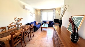 A living room with a dining table, chairs, a sofa, and a coffee table. - 0356 Monte Javea Calicanto (Javea / Xàbia)