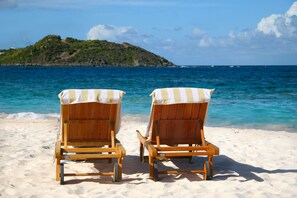 On the beach, sun loungers, beach towels