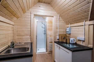 Fridge, stovetop, electric kettle, cookware/dishes/utensils