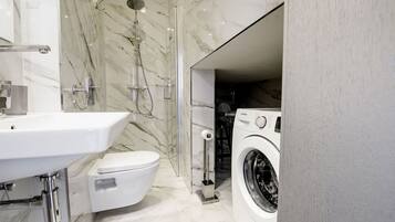 Shower, hair dryer, towels, soap